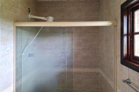 Casa de condomínio para alugar com 130m², 3 quartos e 2 vagasBanheiro da Suíte 1
