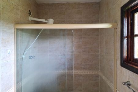 Casa de condomínio para alugar com 130m², 3 quartos e 2 vagasBanheiro da Suíte 1