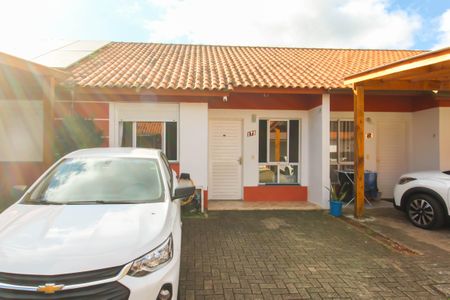 Casa de condomínio à venda com 57m², 2 quartos e 2 vagasFachada 