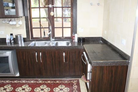 Casa de condomínio para alugar com 750m², 4 quartos e 3 vagasCozinha