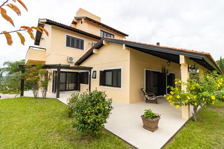 Casa de condomínio para alugar com 455m², 4 quartos e 2 vagasFachada