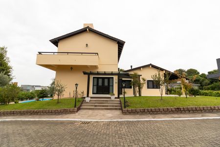 Casa de condomínio para alugar com 455m², 4 quartos e 2 vagasFachada