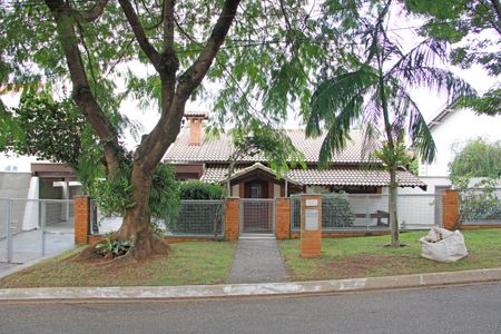 Casa de condomínio para alugar com 399m², 4 quartos e 4 vagasFachada 