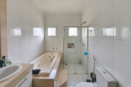 Casa de condomínio à venda com 262m², 4 quartos e 4 vagasBanheiro Suíte 1