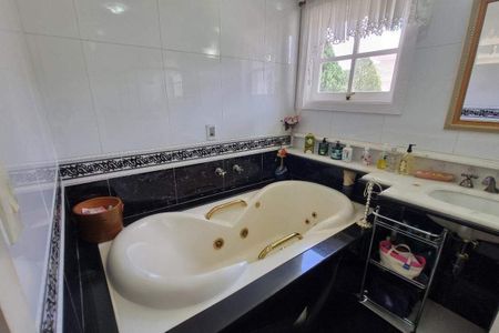 Casa de condomínio à venda com 387m², 4 quartos e 4 vagas