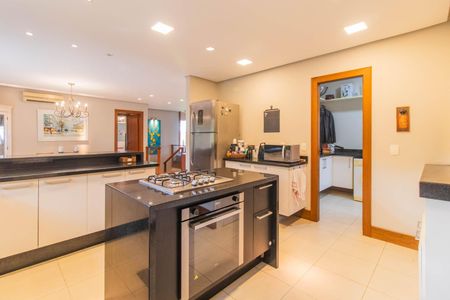 Casa de condomínio à venda com 249m², 3 quartos e 4 vagas Casa de condomínio à venda com 249m², 3 quartos e 4 vagasCozinha e Área de Serviço