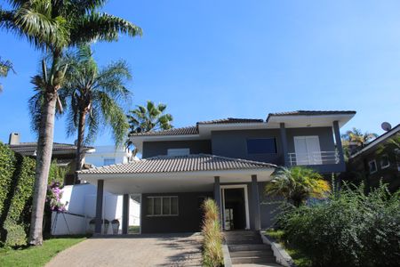 Casa de condomínio para alugar com 295m², 4 quartos e 2 vagasFachada