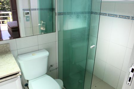 Casa de condomínio para alugar com 295m², 4 quartos e 2 vagasBanheiro da Suíte 2