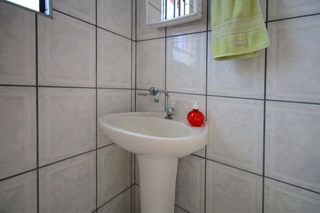 Casa à venda com 261m², 4 quartos e 4 vagasBanheiro de serviço