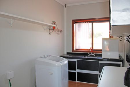 Casa de condomínio para alugar com 300m², 4 quartos e 3 vagasCozinha e Área de Serviço