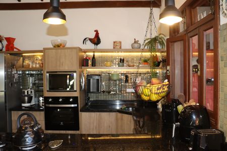 Casa de condomínio para alugar com 323m², 4 quartos e 5 vagasCozinha