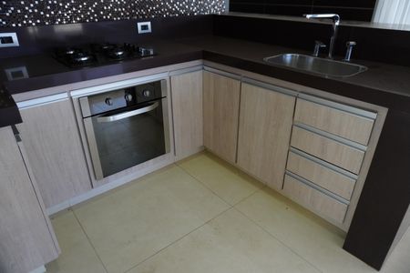 Casa de condomínio para alugar com 330m², 4 quartos e 4 vagasCozinha