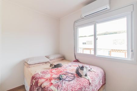 Quarto 1 de casa de condomínio para alugar com 2 quartos, 87m² em Vila Nova, Porto Alegre
