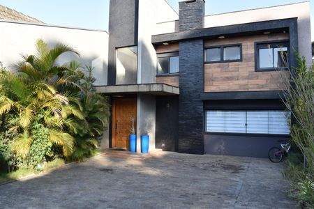 Casa de condomínio para alugar com 319m², 4 quartos e 5 vagasGaragem