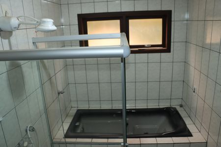 Casa de condomínio para alugar com 253m², 5 quartos e 2 vagasBanheiro Suíte