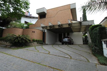 Casa de condomínio para alugar com 450m², 4 quartos e 6 vagasFachada da Casa