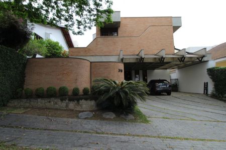 Casa de condomínio para alugar com 450m², 4 quartos e 6 vagasFachada da Casa