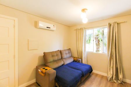 Sala de casa de condomínio à venda com 3 quartos, 90m² em Harmonia, Canoas