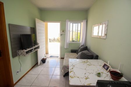 Sala de casa de condomínio à venda com 2 quartos, 50m² em Restinga, Porto Alegre