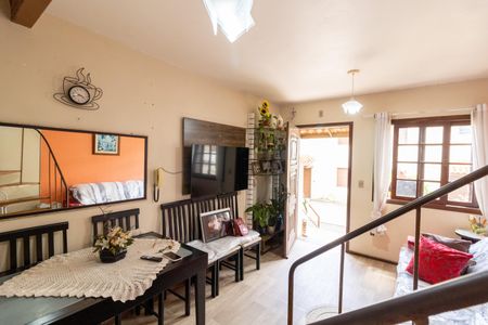 Sala de casa de condomínio à venda com 2 quartos, 70m² em Vila Nova, Porto Alegre