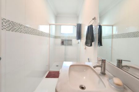 Casa de condomínio à venda com 268m², 4 quartos e 4 vagasBanheiro Suíte 2