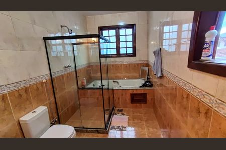 Casa de condomínio à venda com 398m², 5 quartos e 2 vagasBanheiro 1