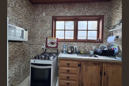 Casa de condomínio à venda com 100m², 2 quartos e 3 vagasCozinha e Área de Serviço