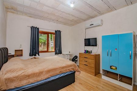 Quarto 1 de casa à venda com 2 quartos, 200m² em Jardim Carvalho, Porto Alegre