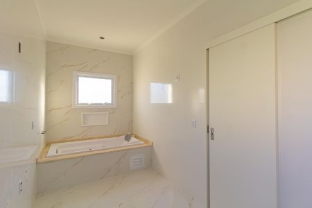 Casa de condomínio à venda com 228m², 3 quartos e 2 vagasBanheiro da Suíte 1