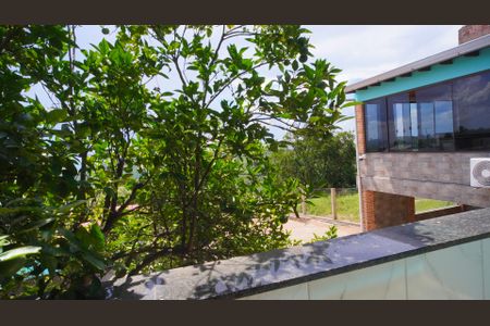 Varanda  de casa à venda com 3 quartos, 380m² em Vila Nova, Porto Alegre