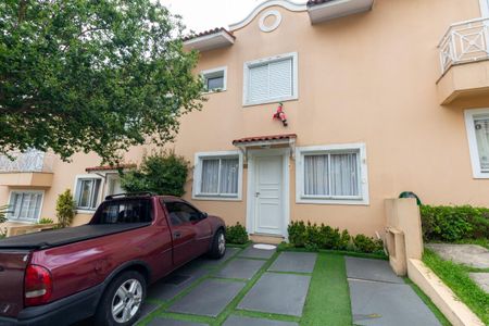 Casa de condomínio para alugar com 180m², 3 quartos e 2 vagasFachada Interna e Garagem