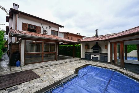 Casa de condomínio para alugar com 375m², 7 quartos e 4 vagasFachada Posterior