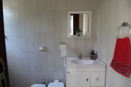 Casa de condomínio para alugar com 240m², 4 quartos e 3 vagasBanheiro de Serviço