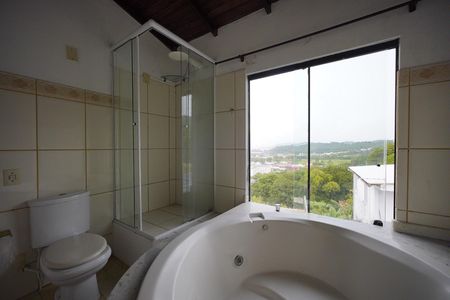 Casa de condomínio para alugar com 120m², 3 quartos e sem vagaBanheiro da Suíte 2