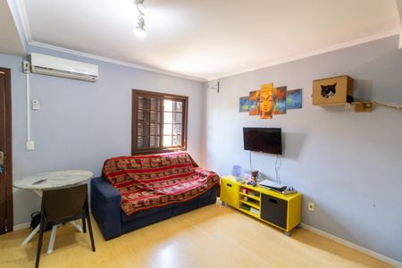 Sala de casa de condomínio à venda com 3 quartos, 90m² em Vila Nova, Porto Alegre