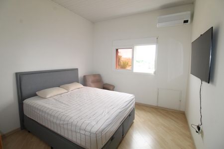 Casa de condomínio para alugar com 405m², 4 quartos e 4 vagasSuíte 1