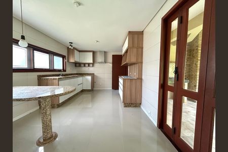 Casa de condomínio para alugar com 385m², 4 quartos e 4 vagasCozinha 