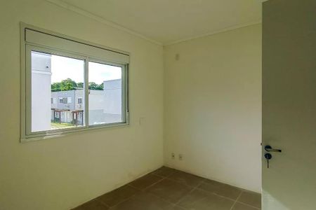 Quarto 2 de casa de condomínio para alugar com 2 quartos, 80m² em Vila Nova, Porto Alegre