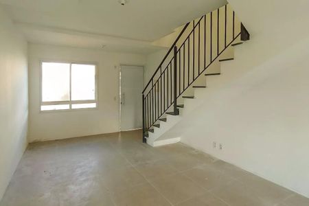 Sala de casa de condomínio para alugar com 2 quartos, 80m² em Vila Nova, Porto Alegre