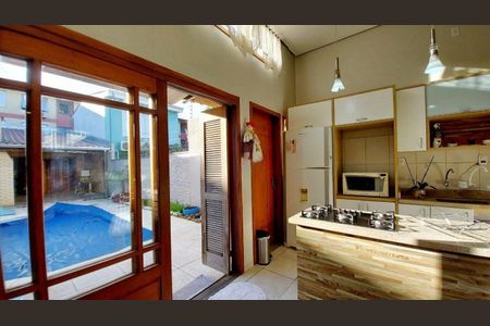 Sala / Cozinha  de casa de condomínio à venda com 3 quartos, 110m² em Partenon, Porto Alegre