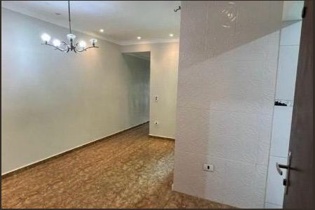 Parede branca com iluminação de teto e piso de porcelanato de apartamento à venda com 3 quartos, 112m² em Vila Eldizia, Santo André