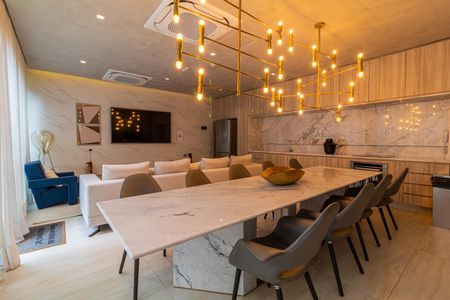 Apartamento à venda com 28m², 1 quarto e sem vagaSala de estar com sofá, mesa de jantar e iluminação moderna, ambiente elegante e acolhedor.