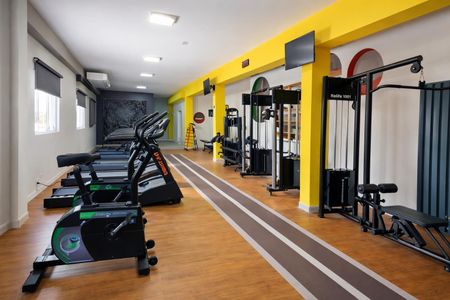 Apartamento à venda com 72m², 3 quartos e 2 vagasGinásio com equipamentos de treino e piso de madeira