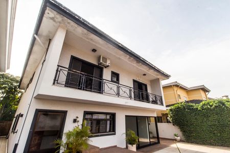 Casa de condomínio à venda com 341m², 4 quartos e 4 vagas Casa de condomínio à venda com 341m², 4 quartos e 4 vagasFachada