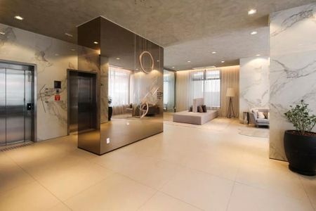 Studio à venda com 29m², 2 quartos e sem vagaSala de estar elegante com decoração moderna e iluminação adequada.