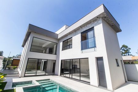 Casa de condomínio à venda com 394m², 5 quartos e 6 vagas Casa de condomínio à venda com 394m², 5 quartos e 6 vagasFachada