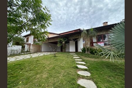 Casa de condomínio para alugar com 375m², 4 quartos e 4 vagasFachada