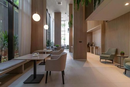 Sala de estar com móveis modernos e iluminação natural, perfeita para relaxar e socializar. de kitnet/studio à venda com 1 quarto, 22m² em Perdizes, São Paulo