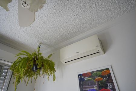 Sala ar condicionado  de apartamento à venda com 3 quartos, 69m² em Vila Nova, Porto Alegre