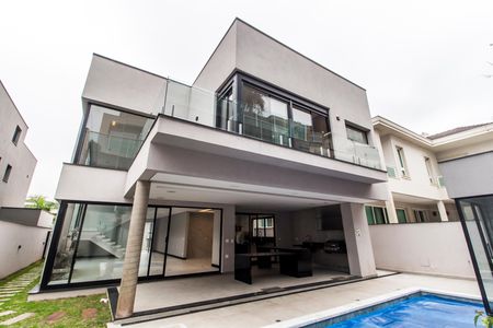 Casa de condomínio à venda com 423m², 4 quartos e 4 vagas Casa de condomínio à venda com 423m², 4 quartos e 4 vagasFachada